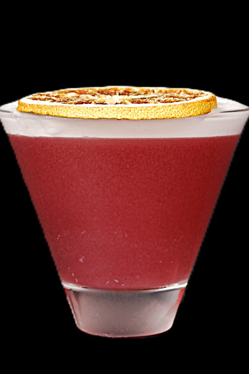 The Alchemist's Key — crimson Nash Keys martini with white foam and a dried orange chip