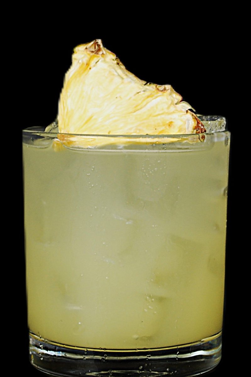 The Spice Girl — golden Nash Keys cocktail crowned with charred pineapple